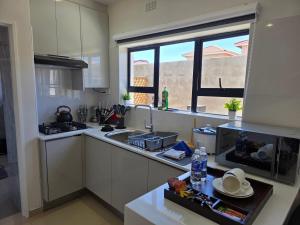 Kuchyň nebo kuchyňský kout v ubytování Amakhaya Escape