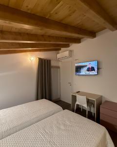 Una cama o camas en una habitación de B&B Battista