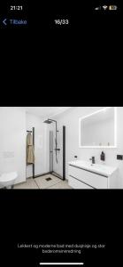 a white bathroom with a sink and a shower at Cozy Guest Room in Mandal, Norway - Shared Facilities in Ime +4 photos