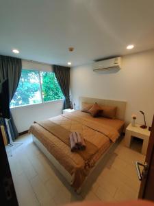 Ένα ή περισσότερα κρεβάτια σε δωμάτιο στο Relaxing Apartment in Karon