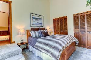 a bedroom with a large bed and a couch at 3 Spyglass in Sunriver