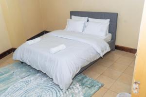 Ένα ή περισσότερα κρεβάτια σε δωμάτιο στο Zen Escape Nanyuki