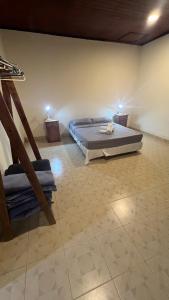 a bedroom with a large bed in a room at Mango Home Iguazú in Puerto Iguazú