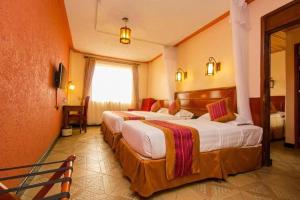 a hotel room with two beds and a window at Nairobi Seasons Airport Hotel in Nairobi +10 photos