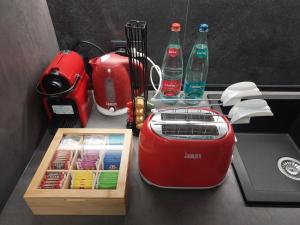 a toaster sitting on a counter with soda bottles at La Pergola in Postalesio