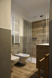 a bathroom with a sink and a toilet and a shower at La Pergola in Postalesio +32 photos
