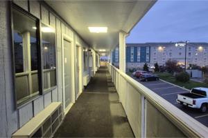 an empty hallway of a building with a parking lot at Economy Inn By Townhouse Merrillville US 30 in Merrillville