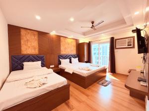 Ένα ή περισσότερα κρεβάτια σε δωμάτιο στο 5-STAR HOTEL in Digha with #S-Pool #Conference Hall #Premium Room #Restaurant- JAIRAM WAY-BAY +85 φωτογραφίες