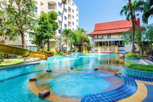 a swimming pool with a slide in a resort at First Hua Hin - Hin Nam Condo in Hua Hin