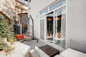 a balcony with a bench and a window with at Yankı Hotel in Çekirge