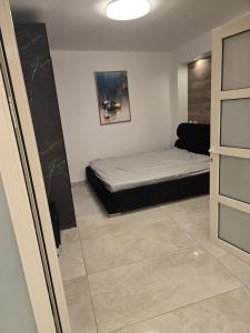 a bedroom with a bed in the corner of a room at Nancy zimr 1 in Massada