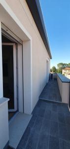 an empty hallway of a building with an open door at Casa Tintoretto The Charm of Venice in 15 minutes! in Venice