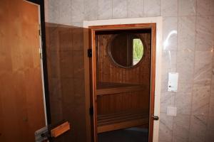 a door to a room with a mirror in a room at Åsele Wärdshus in Åsele