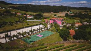 an aerial view of a house with a tennis court at Casa Beatnik Country House in Santiago de Compostela +78 photos