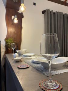 a table with a wine glass on top of it at Rock Harmony Villa in Hikkaduwa +20 photos
