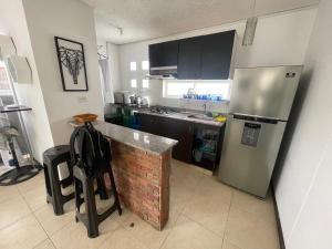 Η κουζίνα ή μικρή κουζίνα στο Apartasol santafe live