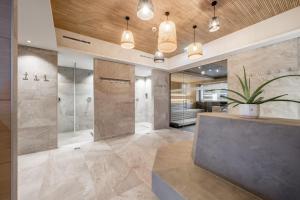 a bathroom with a shower and a sink at Camping Sölden Apartments in Sölden