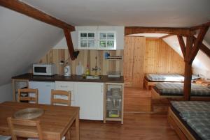 a kitchen and dining area of a house at Penzion Stáj Návary in Návary