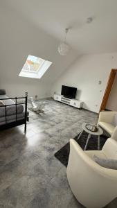 TV a/nebo společenská místnost v ubytování Adler Haus