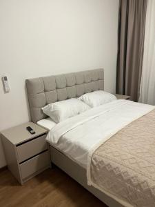 Postel nebo postele na pokoji v ubytování Apartman Lux Capital