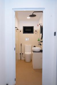 a bathroom with a toilet and a sink at Cinnamon Wave Villa - Thalaramba, Mirissa in Matara