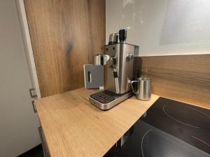 Η κουζίνα ή μικρή κουζίνα στο dengg down town studios