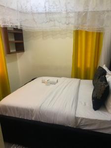 Ένα ή περισσότερα κρεβάτια σε δωμάτιο στο Excelesior bnb