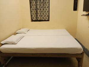 Ένα ή περισσότερα κρεβάτια σε δωμάτιο στο BM Shaw Guest House