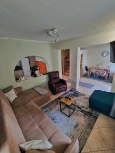 a living room with a couch and a table at Citadel's Tranquility Ioannina in Ioannina