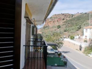 a balcony with a view of a mountain at Hotel Restaurante Atalaya in Comares