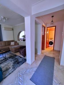 a living room with a couch and a table at Citadel's Tranquility Ioannina in Ioannina