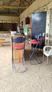 a group of chairs sitting in front of a chalkboard at Monique CZ Abomey Plage in Abomey