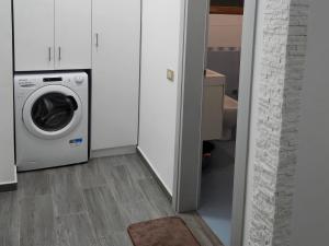 a laundry room with a washing machine in it at Albert's house for rent in Vlorë