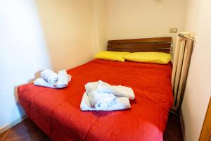 Ένα ή περισσότερα κρεβάτια σε δωμάτιο στο Il Rifugino