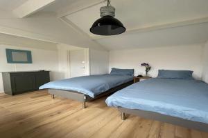 Ένα ή περισσότερα κρεβάτια σε δωμάτιο στο Holiday Home Warmenhuizen near Dunes