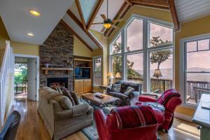 a living room filled with furniture and a fireplace at Echota Ridge Boulders in Banner Elk