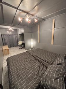 a bedroom with a large bed in a room at BUNKA HOUSE OSAKA room d in Osaka