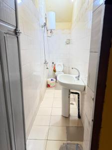a bathroom with a sink and a toilet at Thurin imo nord STUDIO in Saint-Louis