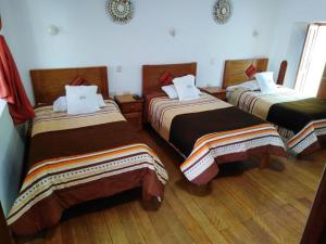 Ένα ή περισσότερα κρεβάτια σε δωμάτιο στο Casona Tupac Hotel Cusco +22 φωτογραφίες
