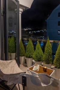 a room with potted trees on a balcony at night at Bae Villa Đà Lạt in Da Lat +50 photos