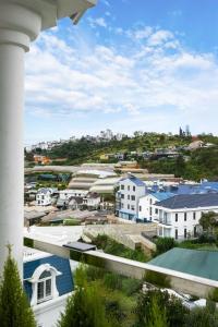 a view of a city from a balcony at Bae Villa Đà Lạt in Da Lat