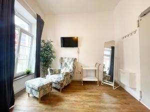 Μια τηλεόραση ή/και κέντρο ψυχαγωγίας στο Charmantes Studio-Apartment in der Altstadt Koblenz