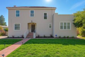 a large white house with a green lawn at Spacious 4 Bed Home - In-Law Unit -Near SF and Napa in Vallejo