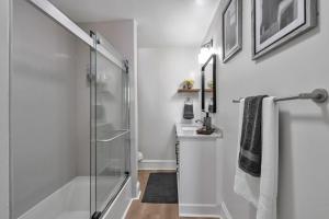 a bathroom with a glass shower and a sink at Spacious 4 Bed Home - In-Law Unit -Near SF and Napa in Vallejo +39 photos