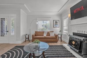 a living room with a couch and a fireplace at Spacious 4 Bed Home - In-Law Unit -Near SF and Napa in Vallejo