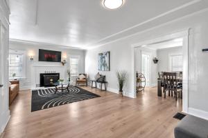 a living room with a fireplace and a dining room at Spacious 4 Bed Home - In-Law Unit -Near SF and Napa in Vallejo