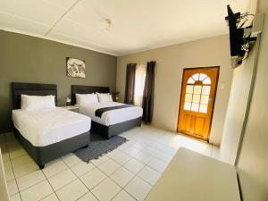 Postel nebo postele na pokoji v ubytování Phola La Bed and Breakfast