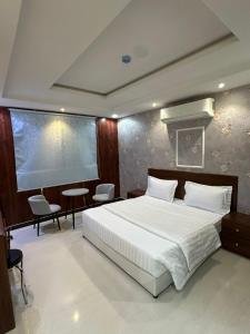 Postel nebo postele na pokoji v ubytování تاج 2 + 5 fotografií