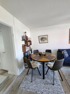 a dining room with a table and chairs at Nice home with free parking close to downtown and nature! in Copenhagen