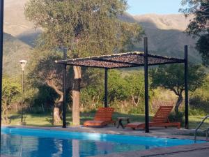 Swimmingpoolen hos eller tæt på Cabaña TayiMapu